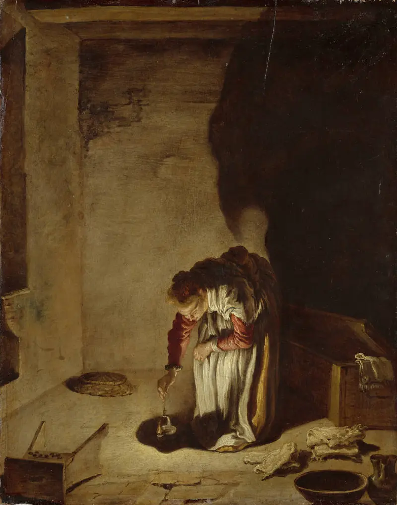 Eine Frau stellt einen Topf auf den Boden 